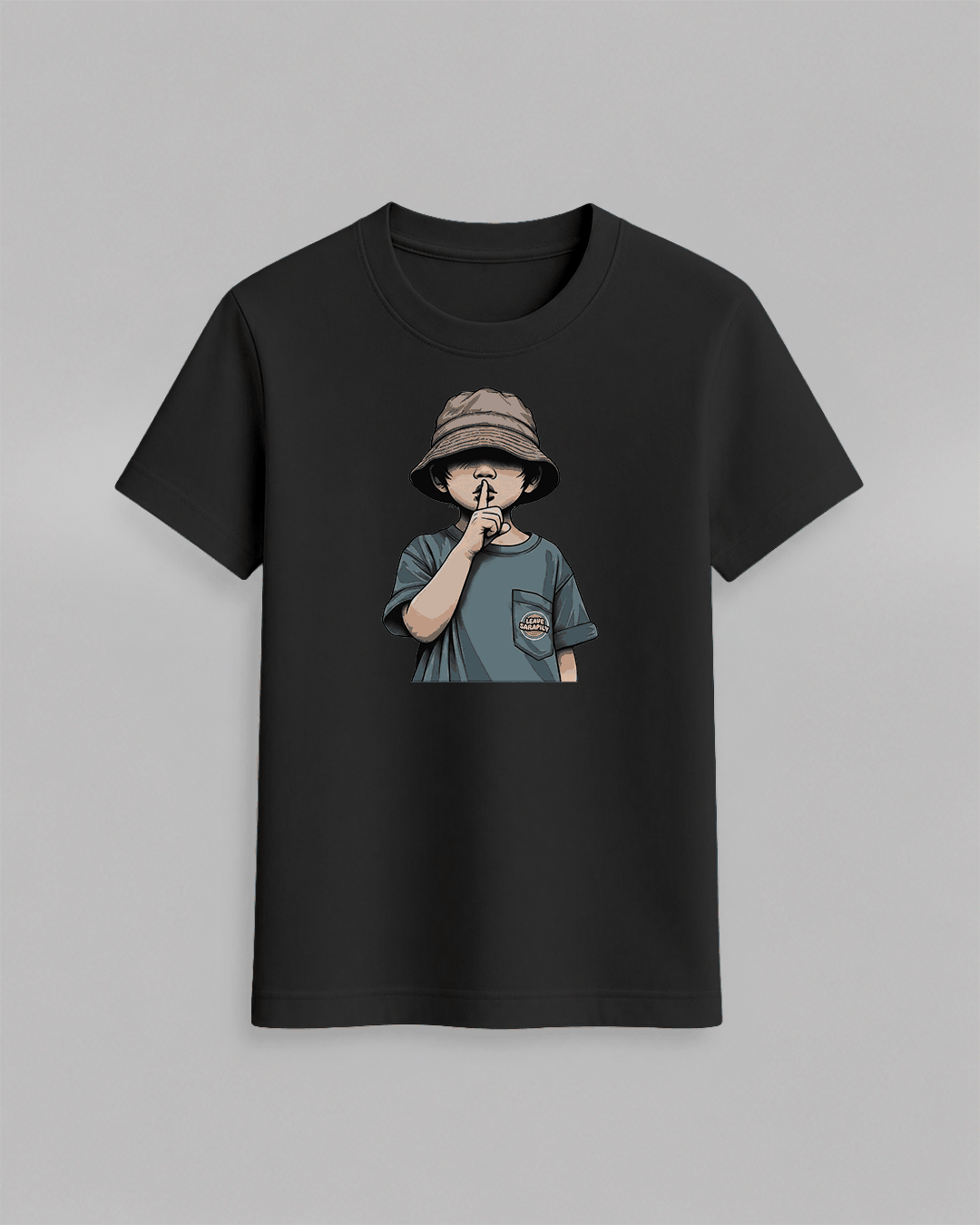 The cap boy T-Shirt in black cotton featuring a graphic of a boy wearing a bucket hat with finger on lips printed on front