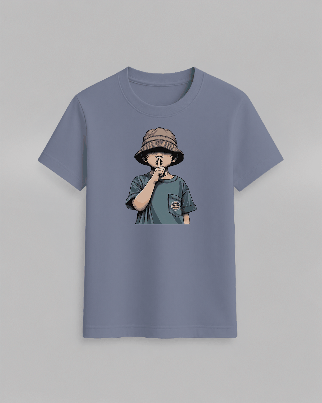 The cap boy T-Shirt in muted blue featuring a graphic of a boy wearing a brown bucket hat with finger to lips, cotton fabric