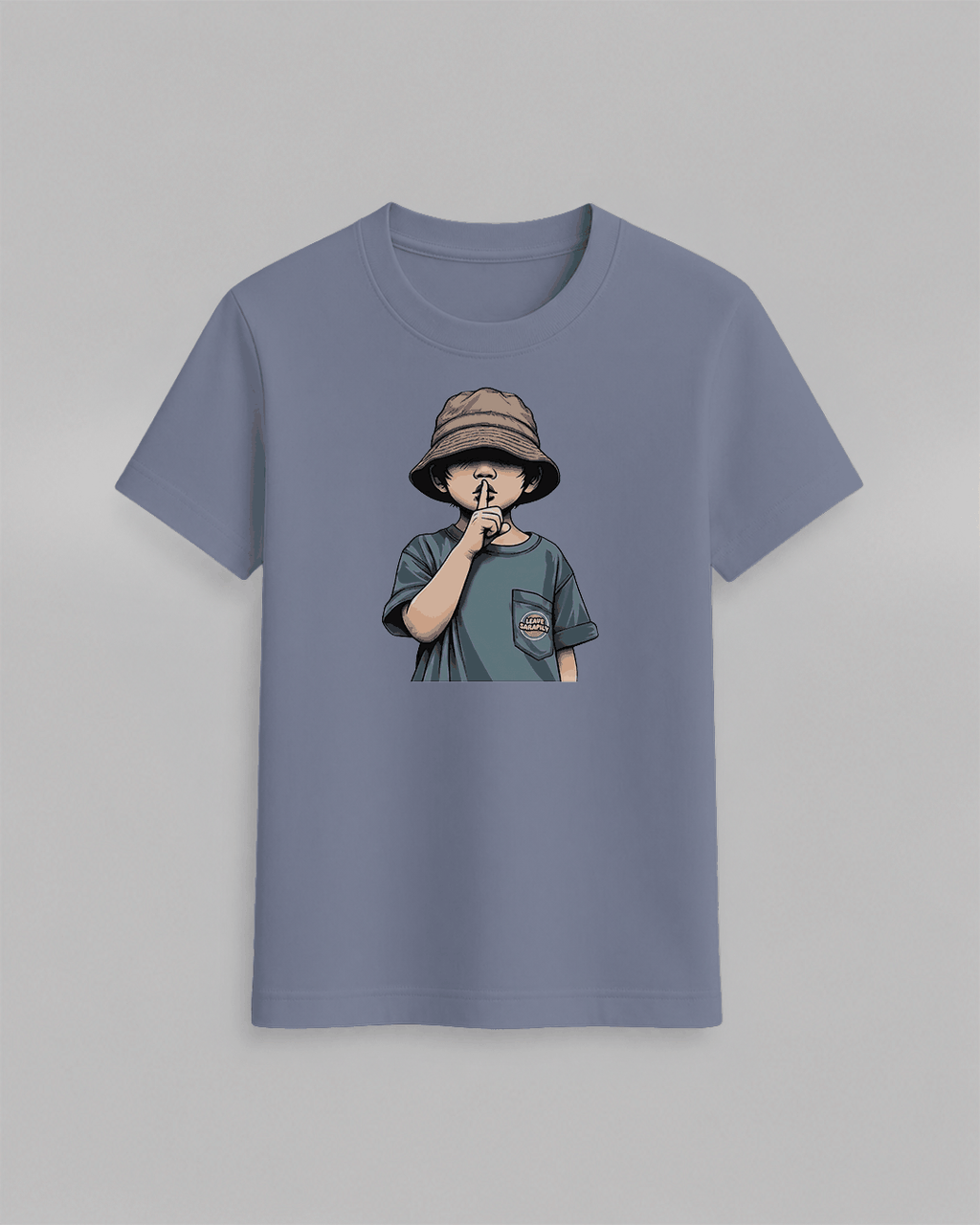 The cap boy T-Shirt in muted blue featuring a graphic of a boy wearing a brown bucket hat with finger to lips, cotton fabric